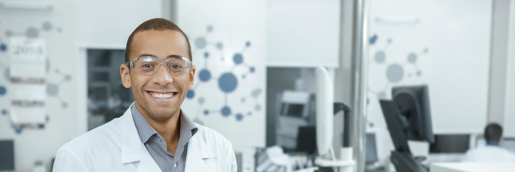 Scientist in lab in white coat