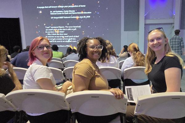 The students, Elli Naso, Makenna Brown, and Ja’Laura Morris, presented a talk about their proposed flight experiment, met with other student teams from around the world, and toured the Space Center.  