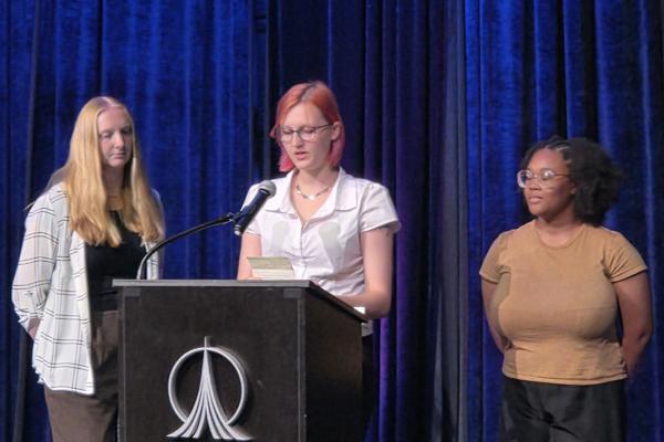 The students, Elli Naso, Makenna Brown, and Ja’Laura Morris, presented a talk about their proposed flight experiment, met with other student teams from around the world, and toured the Space Center.  