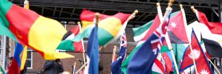 a jumble of international flags waving