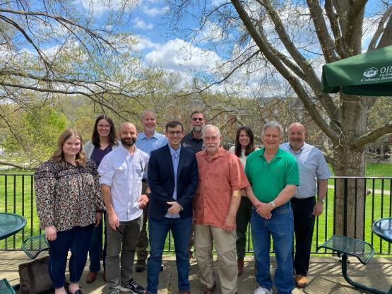 The Alumni Board posing together outside