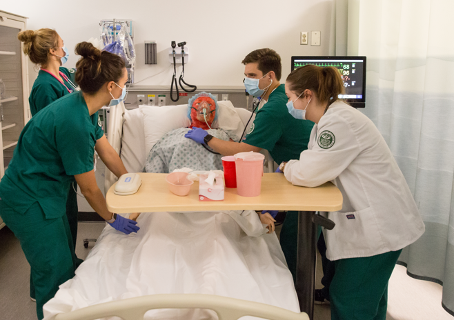 Students participating in a simulation lab