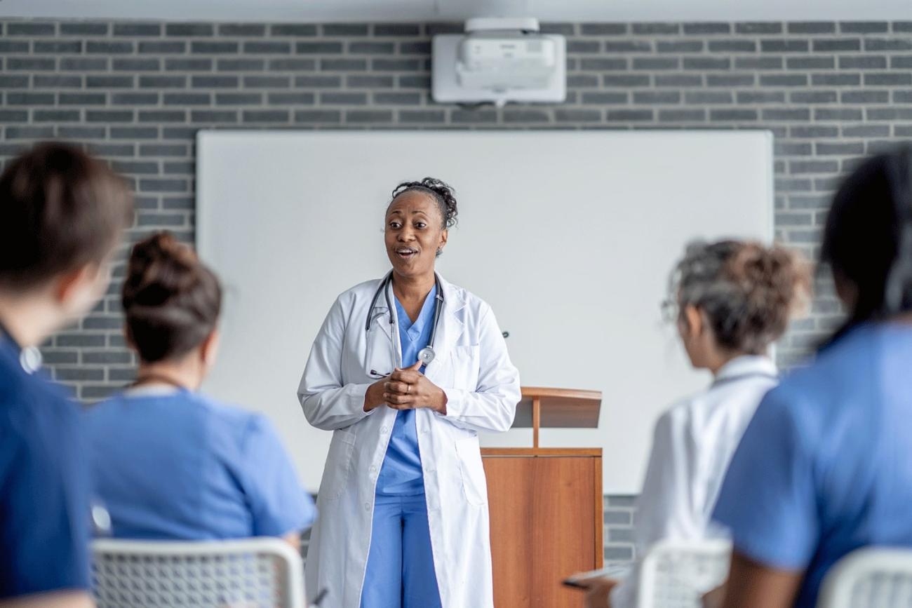 Nurse Educator in front of a classroom of student nurses