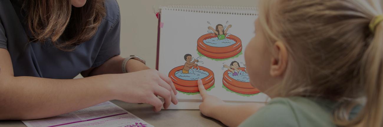 An Ohio University student works on speech with a child