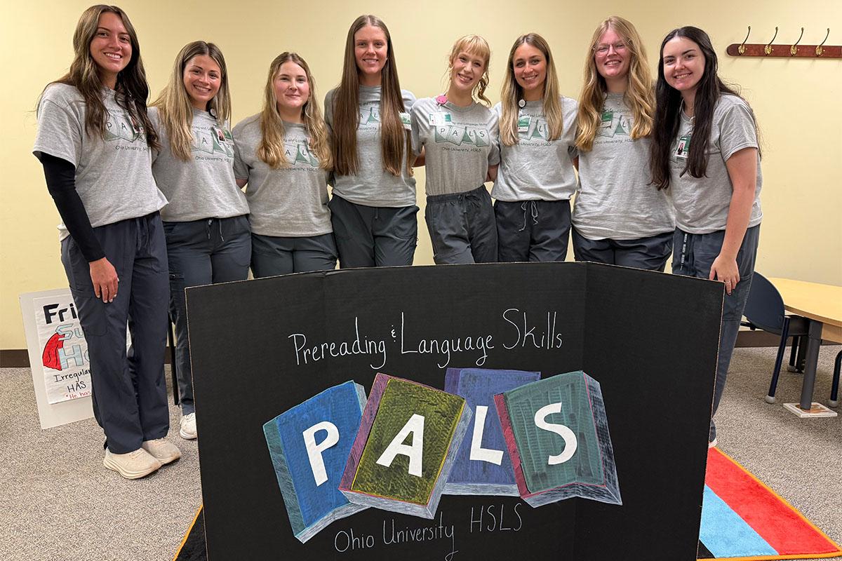 Speech language pathology graduate students who work in the PALS Program pose for a photo.