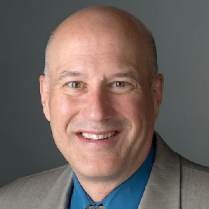 A headshot of Dr. Greg Newton