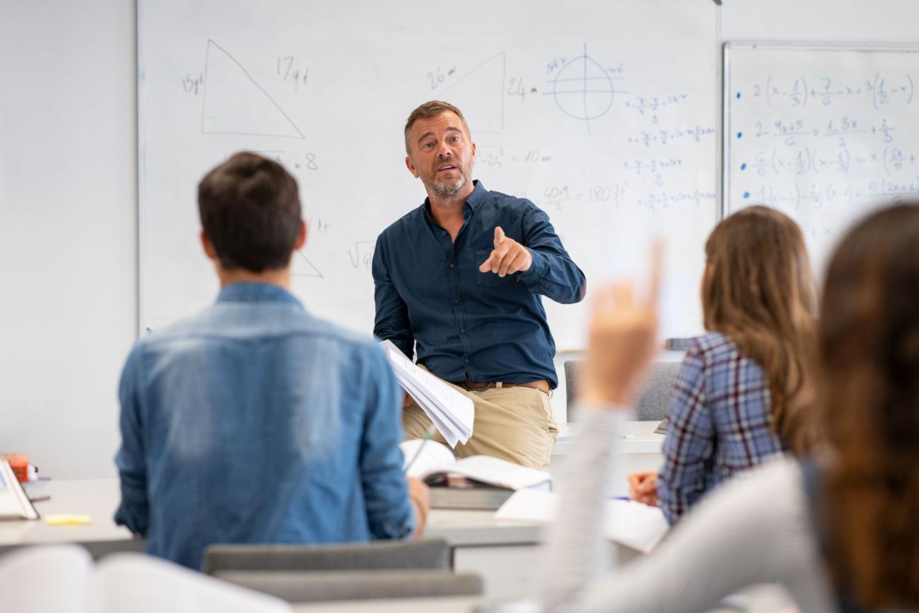 Math teacher in front of a classroom of students
