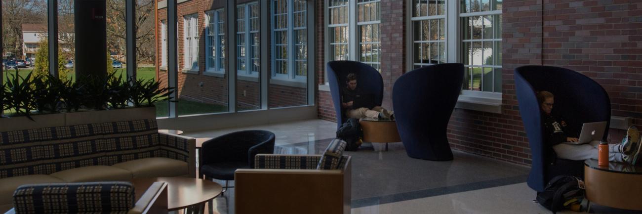 Students sit and study in the atrium on the first floor of Patton Hall.