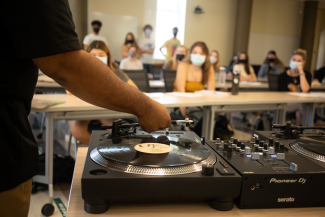 Jason Rawls in class with record player