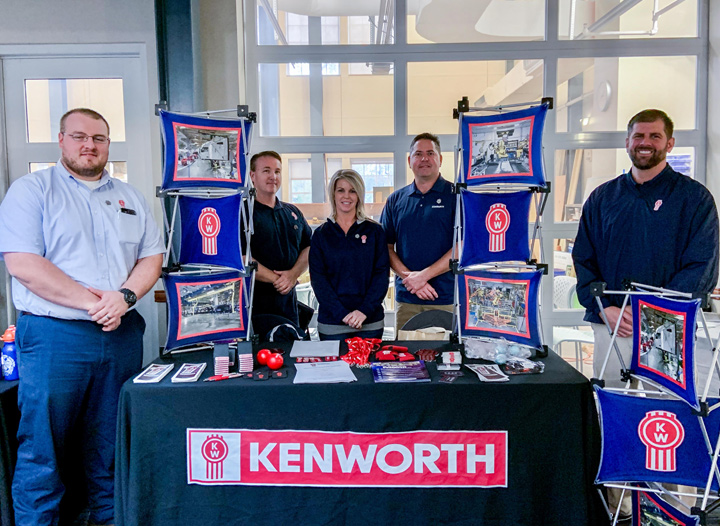 Kenworth employees at a booth at the Russ College career fair in the Academics and Research Center