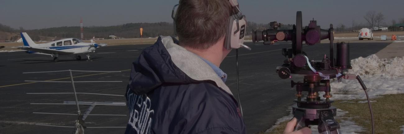 Tom Brooks working on Theodolite at Airport