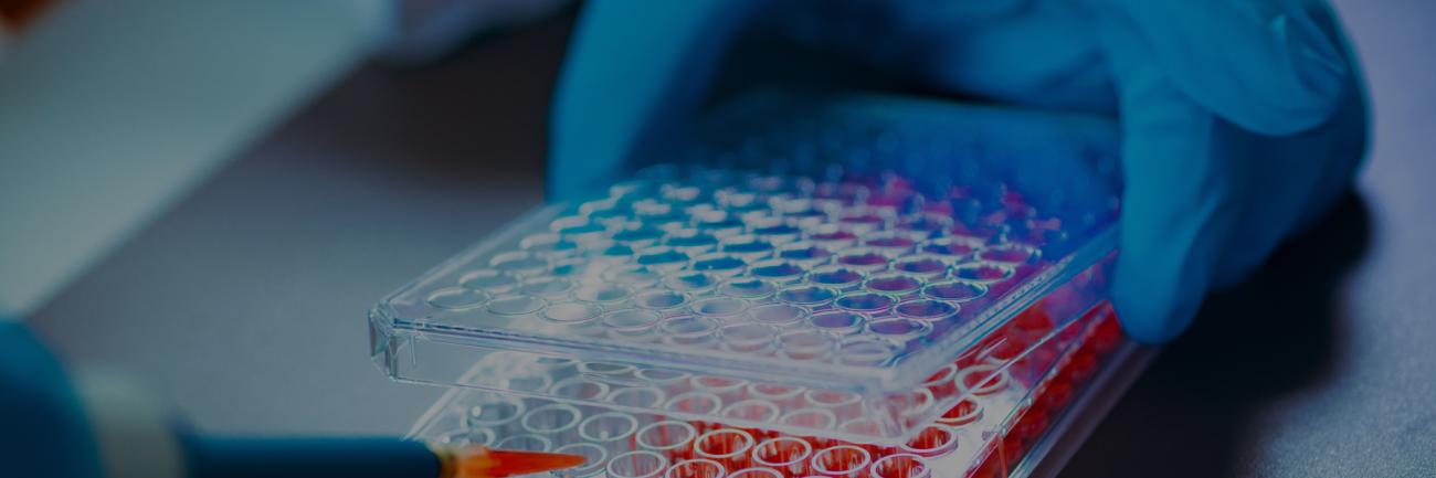 illustration of gloved hand an petri dish