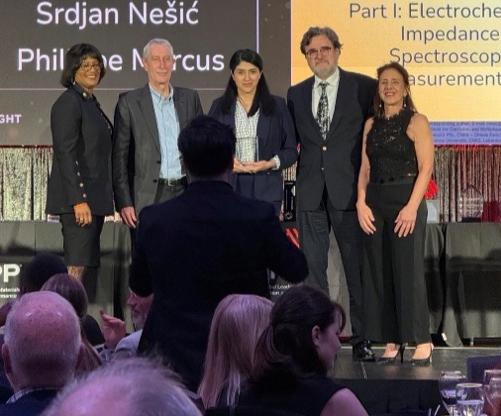 Five recipients of the Ivy M. Parker award stand on stage after receiving their award