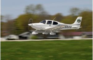 A pilot flying a small Ohio University plane.