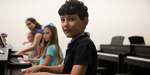 Students practice piano