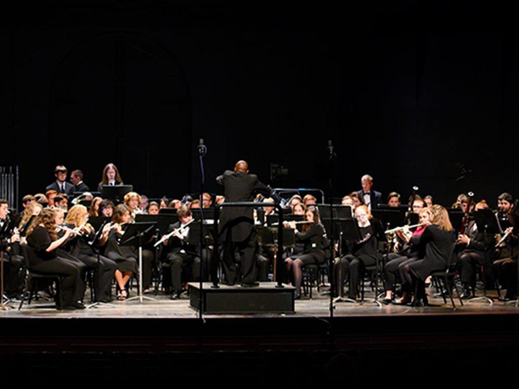 Band on stage with conductor