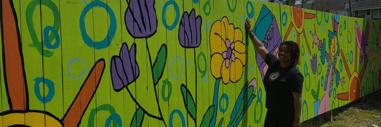 An OHIO art student stands by her work