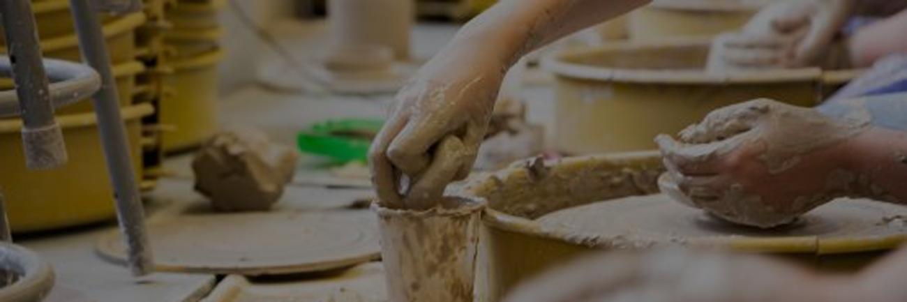 Ohio University ceramics students at work on wheels