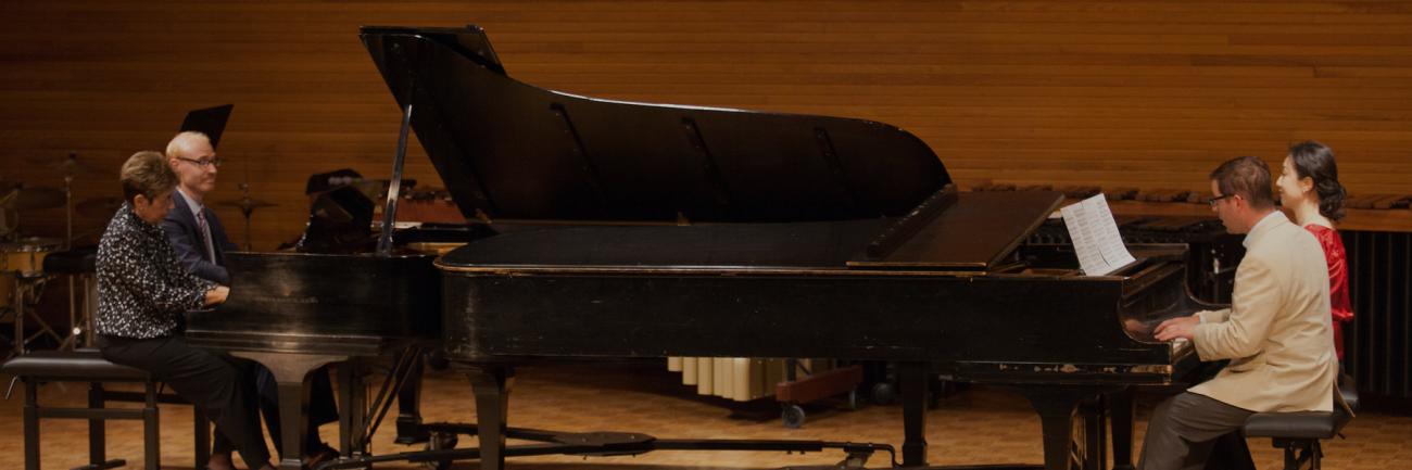 Gail Berenson, Professor Emeritus of Piano Performance, and Christopher Fisher, Professor of Piano, Sean Parsons, Assistant Professor of Jazz Studies and Music Theory, and Youmee Kim, Assistant Professor of Piano, play Hungarian Dance No. 5 in F-sharp in Glidden Hall during the Faculty and Alumni Centennial Chamber Music Recital.