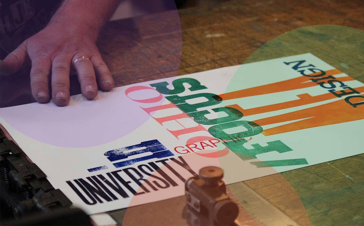 Students touch a printed piece.