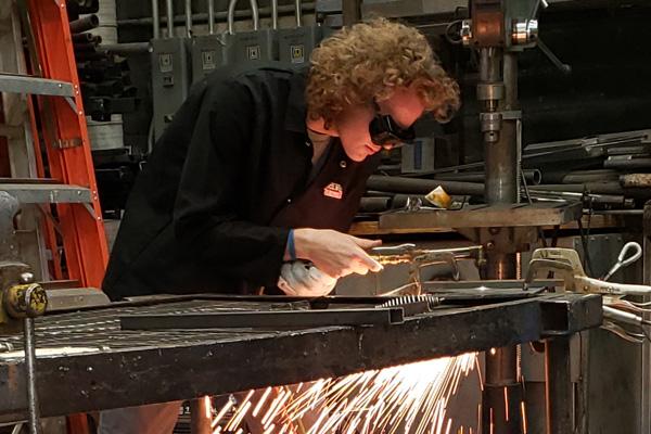 An Ohio University technician welding