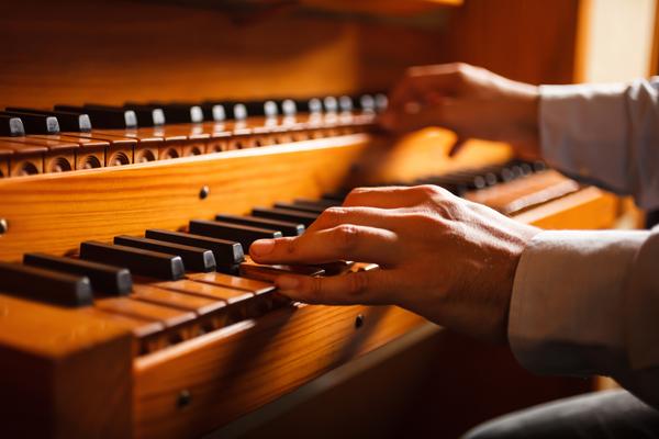 A man playing an organ