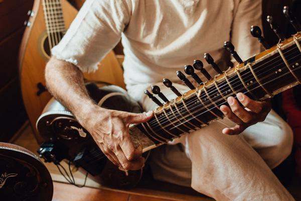 A sitar played by an Indian musician