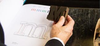 Designer Oscar Fernandez compares wooden block type to printed form