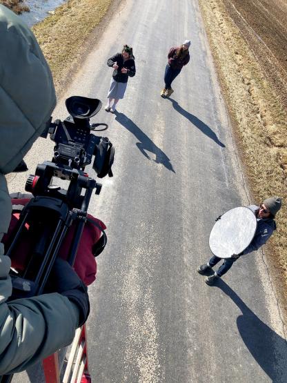 School of Film students collaborate on the set of a student production in 2018.