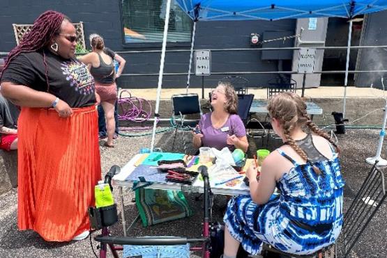 Jada Gee and community members working on art project