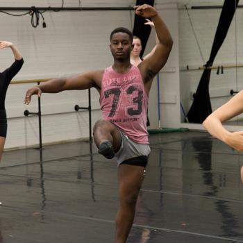 A dance student at Ohio University follows a combination in a studio