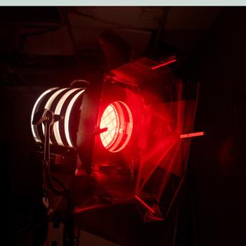 A red spotlight being used by Ohio University students