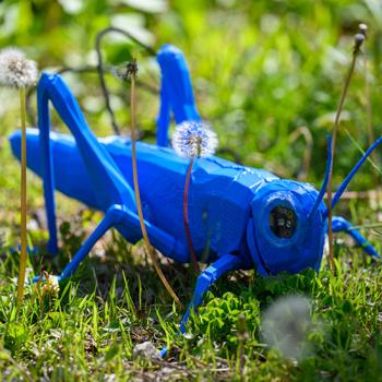 A blue cricket made for an art-plant biology collaboration