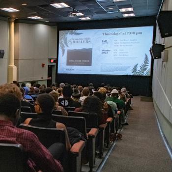 Students watch a film at the Athena Cinema