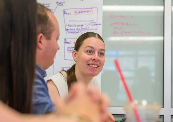 a female working in a group of people
