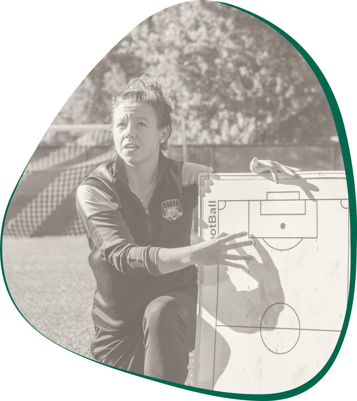 Soccer coach with whiteboard