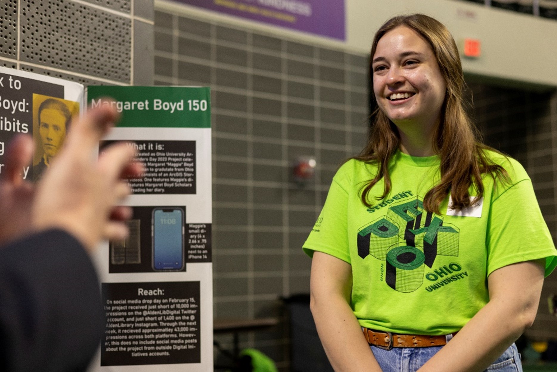 Taylor Burnette talks with dean Neil Romanosky about her research for the 2023 Expo