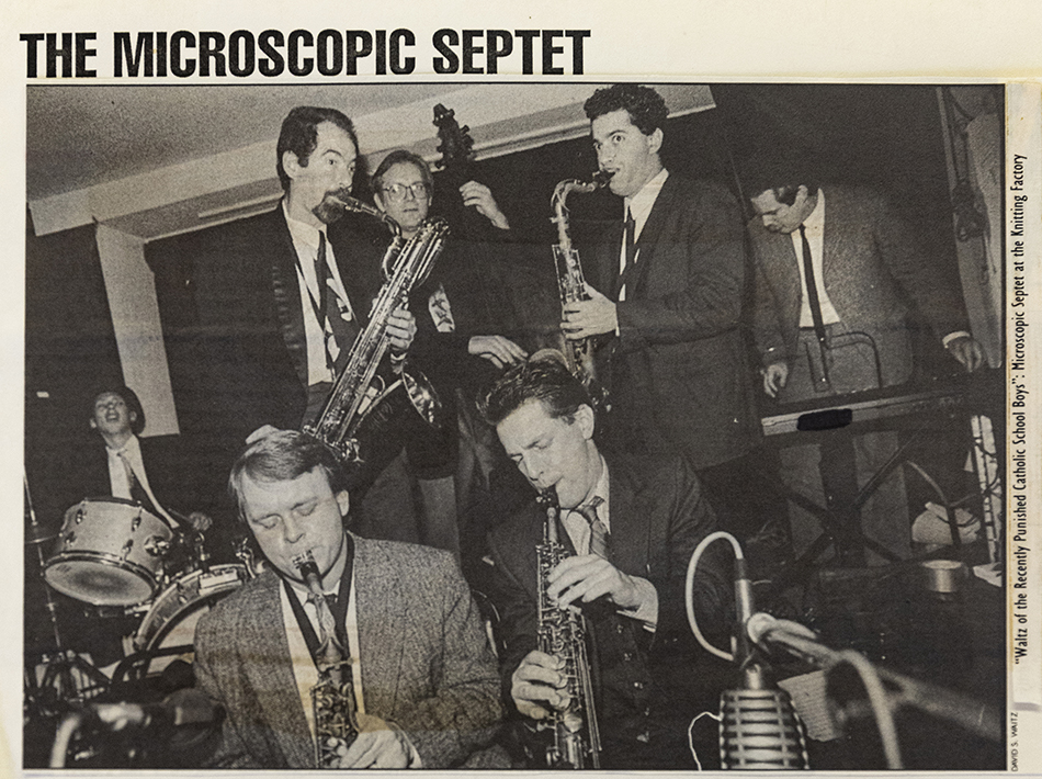 Microscopic Septet poster showing the band in mid-performance