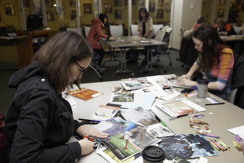 two students work on creating zines