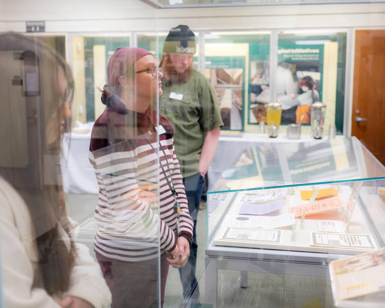 Students and staff view special collections on display at Alden Library