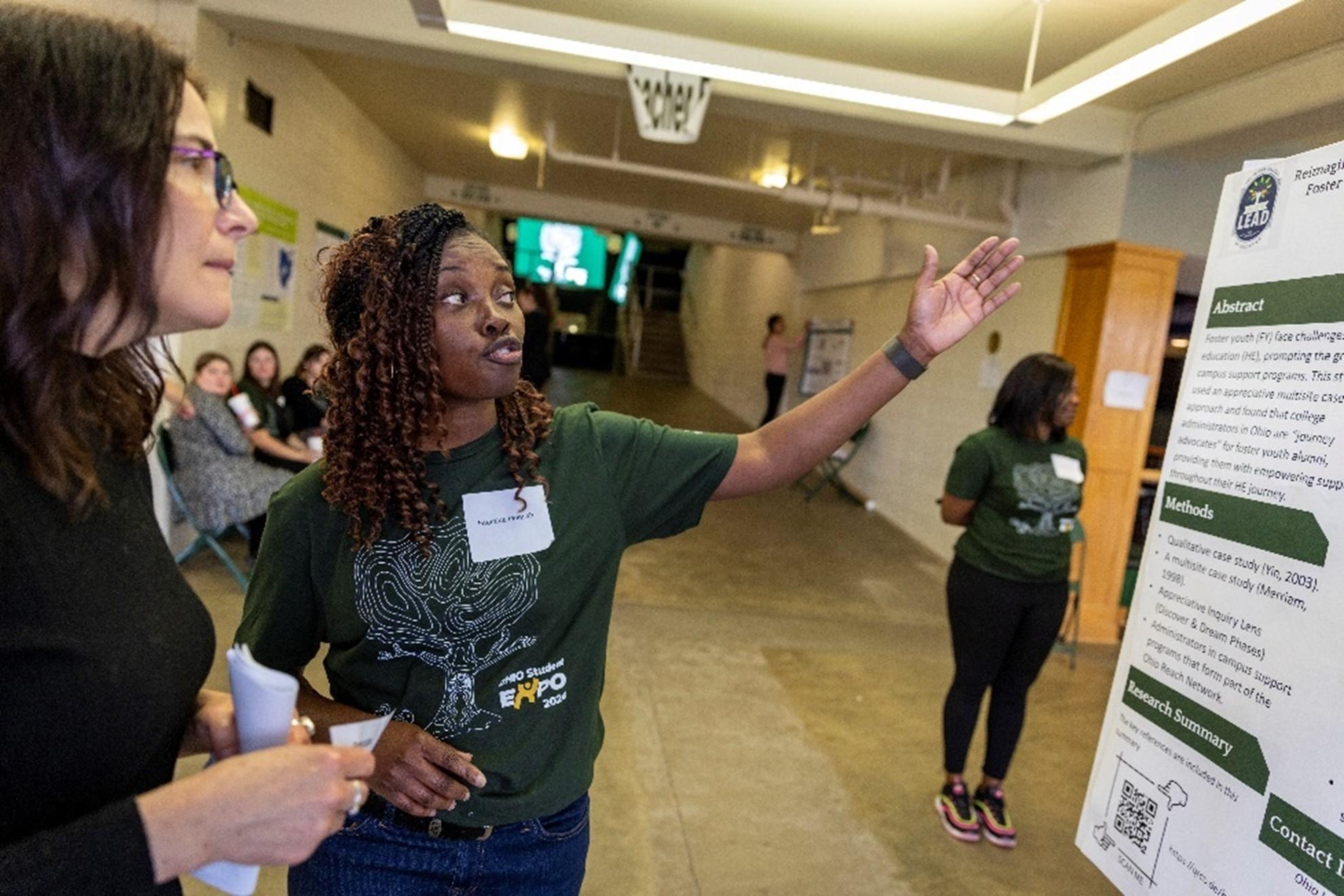 Photo of Faustina Mensah and library dean Janet Hulm at the 2024 Student Expo