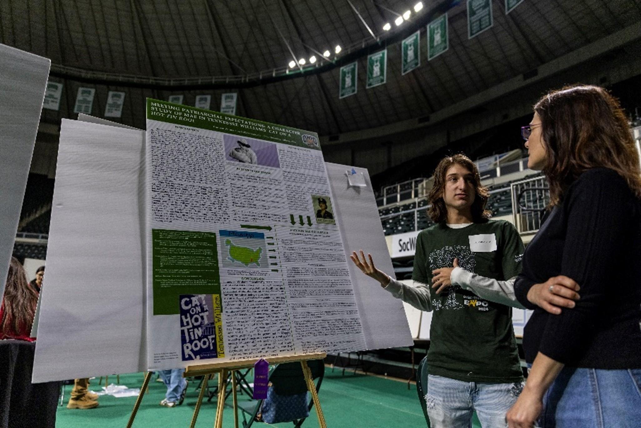 Photo of Brandon Witmer and library dean Janet Hulm at the 2024 Student Expo