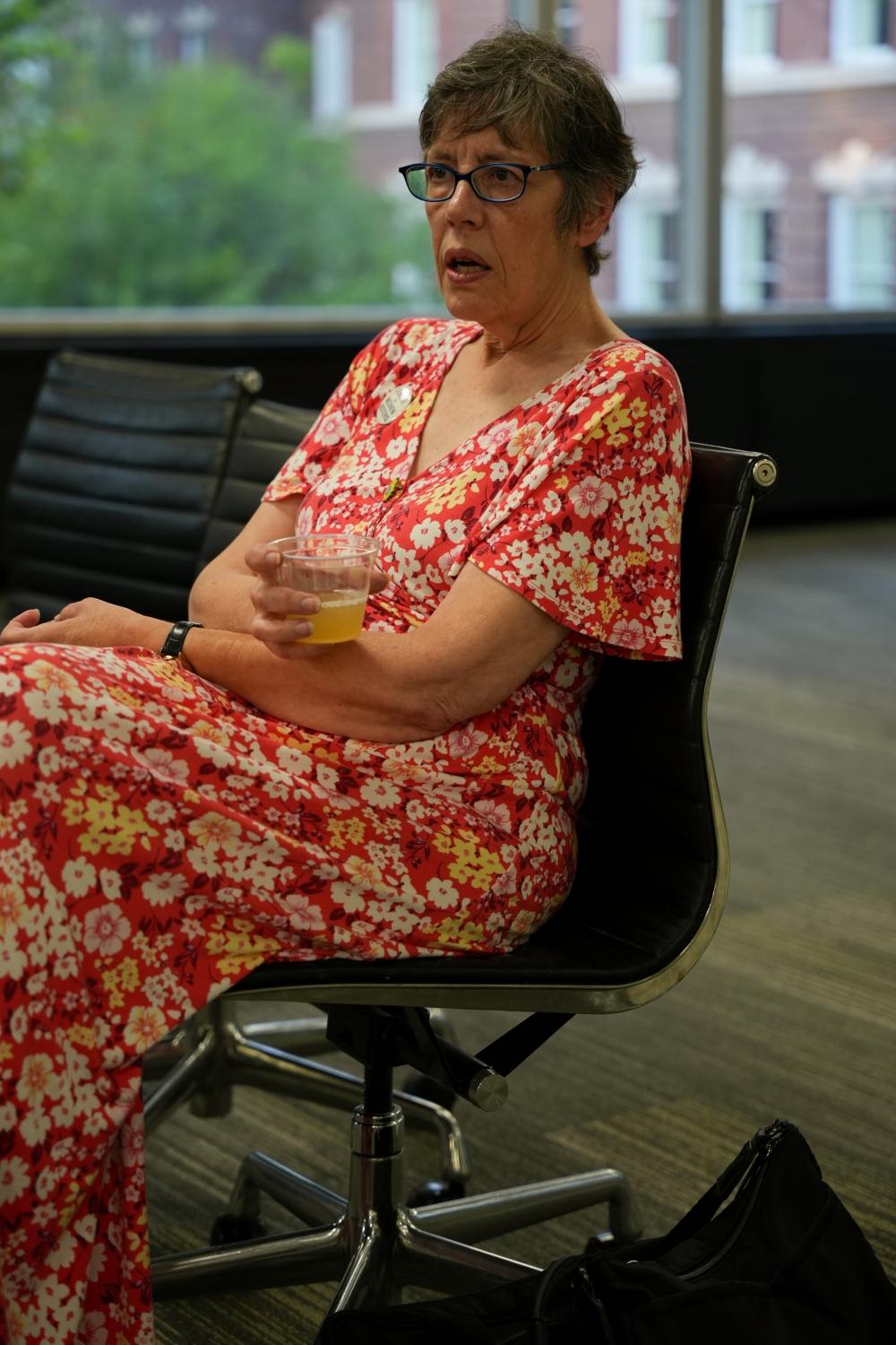 Professor Emerita Katherine Jellison discusses the opening of the “Venturing into Voting” exhibit with Aiden Ryan, a sophomore studying journalism. 