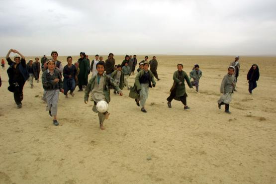 “Hope Renewed by a Universal Game Played by the World’s Most Universal Asset: Children,” Mazar-e-Sharif, Afghanistan. Part of Vaughn-Lahman’s series, “An Afghan Road to War,” circa 2001-2003.