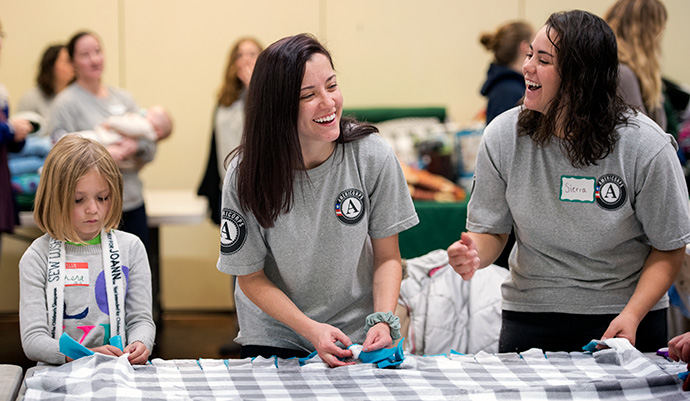Two AmeriCorps members laughing