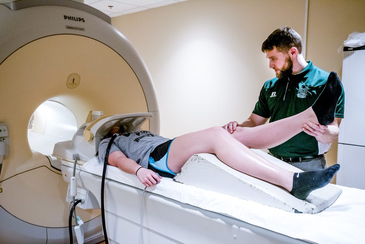 Researcher sends someone through an MRI machine for a scan