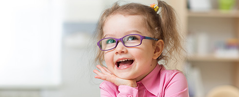 Young child wearing glasses