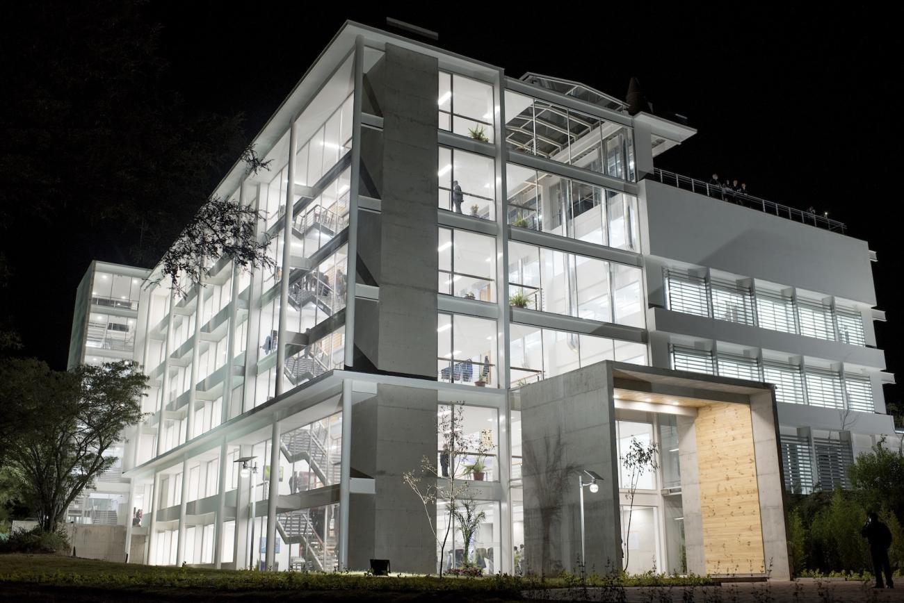 white building at night with all the lights on