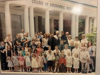The Wagner family poses for a photo in front of the medical school.