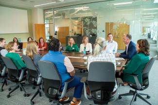 CARE Leader cohort members listen to the Vice President of Health Affairs